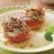 Grilled peaches with berry sauce and pistachio crumble topping
