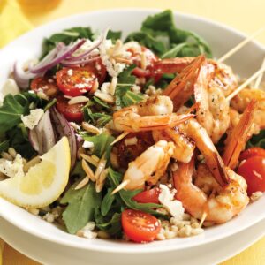 Grilled prawn skewers with barley and almond salad