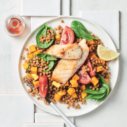 Pan-fried fish with lentil and spinach salad