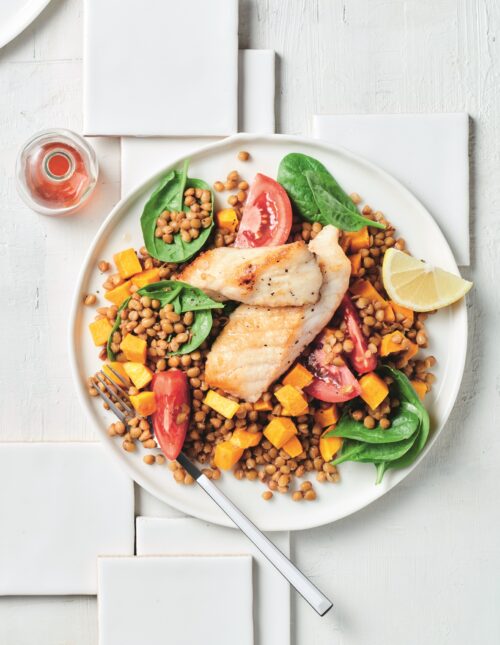 Pan-fried fish with lentil and spinach salad