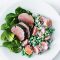 Herb-crusted pork with kumara and pea salad