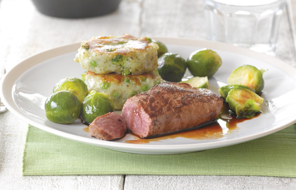Lamb steak with pea and broccoli potato cakes