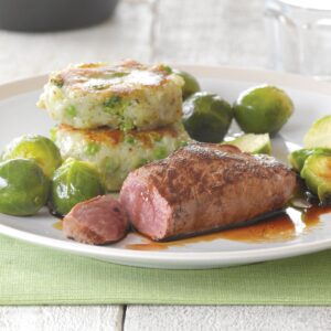 Lamb steak with pea and broccoli potato cakes