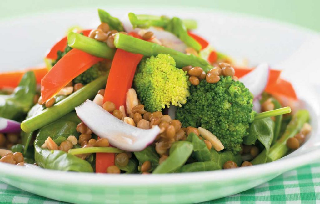 Lentil, vege and tuna salad Plate with lentils, broccoli, carrot, onion, beans and fresh herbs
