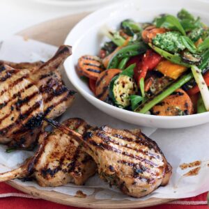Marinated pork cutlets with charred veg and mint pesto