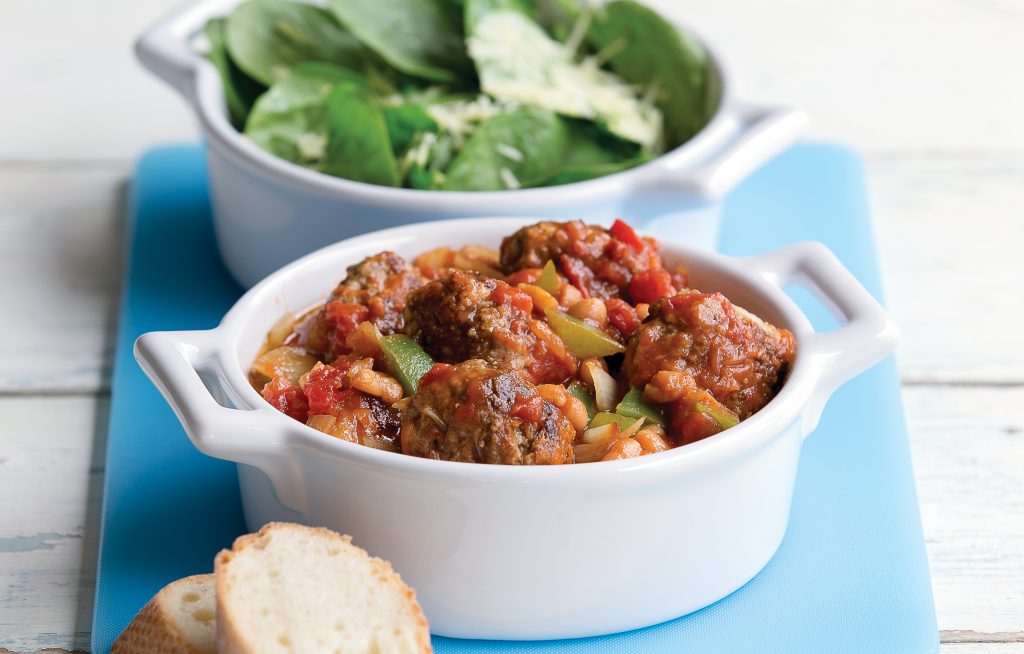 Mini meatballs in a baked bean sauce with leafy green salad and crusty bread Mini meatballs in a baked bean sauce with leafy green salad and crusty bread