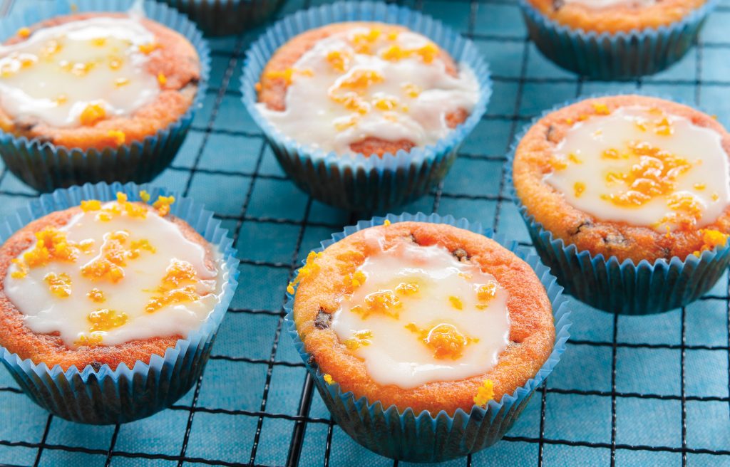 Orange choc-chip muffins with orange icing Orange choc-chip muffins with orange icing