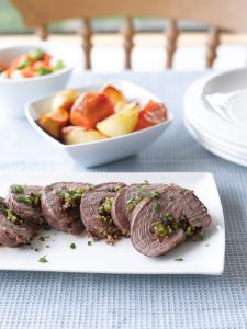 Roast lamb with fruity garlic stuffing