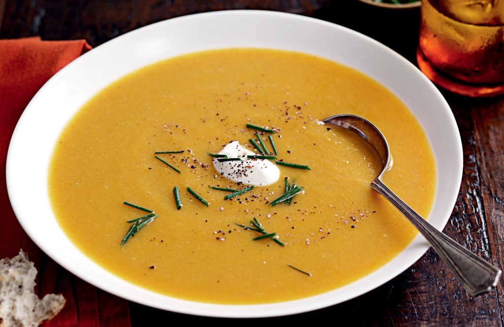 Spiced pumpkin soup with sour cream and chives Spiced pumpkin soup with sour cream and chives