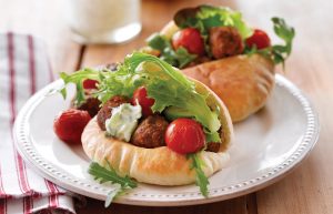 Spicy meatballs with roasted tomatoes and tzatziki