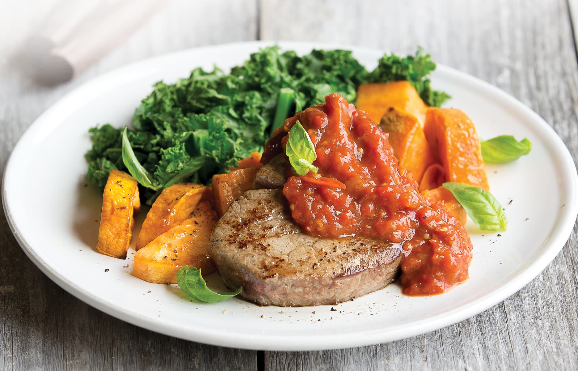 Steak with roasted capsicum, tomato and garlic topping Healthy Food Guide