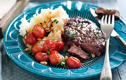 Steak with tomato relish on mustard mash