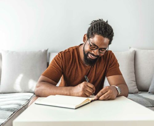 Man writing in diary