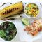 Barbecued prawn skewers with corn and mango chilli salsa