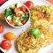 Corn fritters with chargrilled cherry tomatoes and avocado salsa