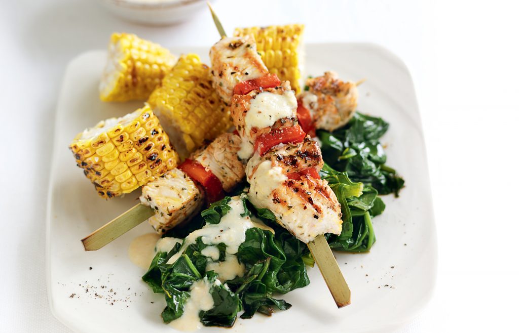 Grilled chicken skewers with hummus yoghurt