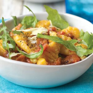 Kumara gnocchi with walnuts and tomato sauce