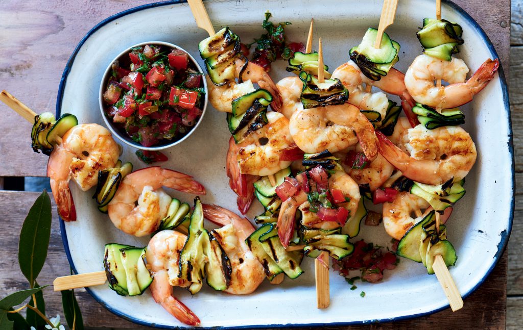 Prawn skewers with lemon, caper and tomato dressing