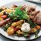 Roasted cauliflower and kumara tray bake with pomegranate dressing