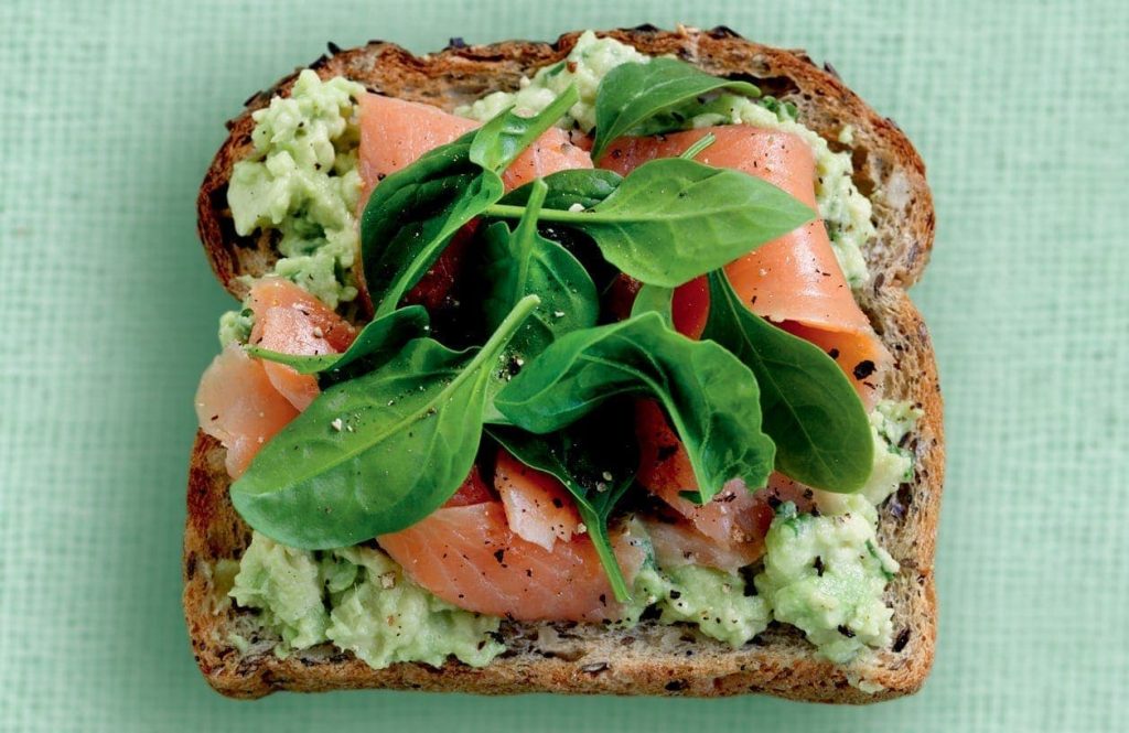 Spicy avocado, salmon and baby spinach on toast Spicy avocado, salmon and baby spinach on toast
