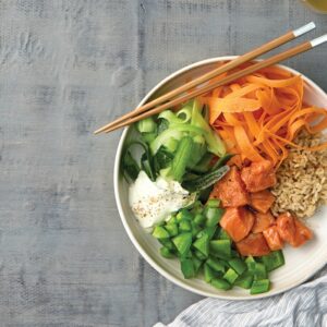 Sushi salad bowl with marinated salmon and wasabi mayo