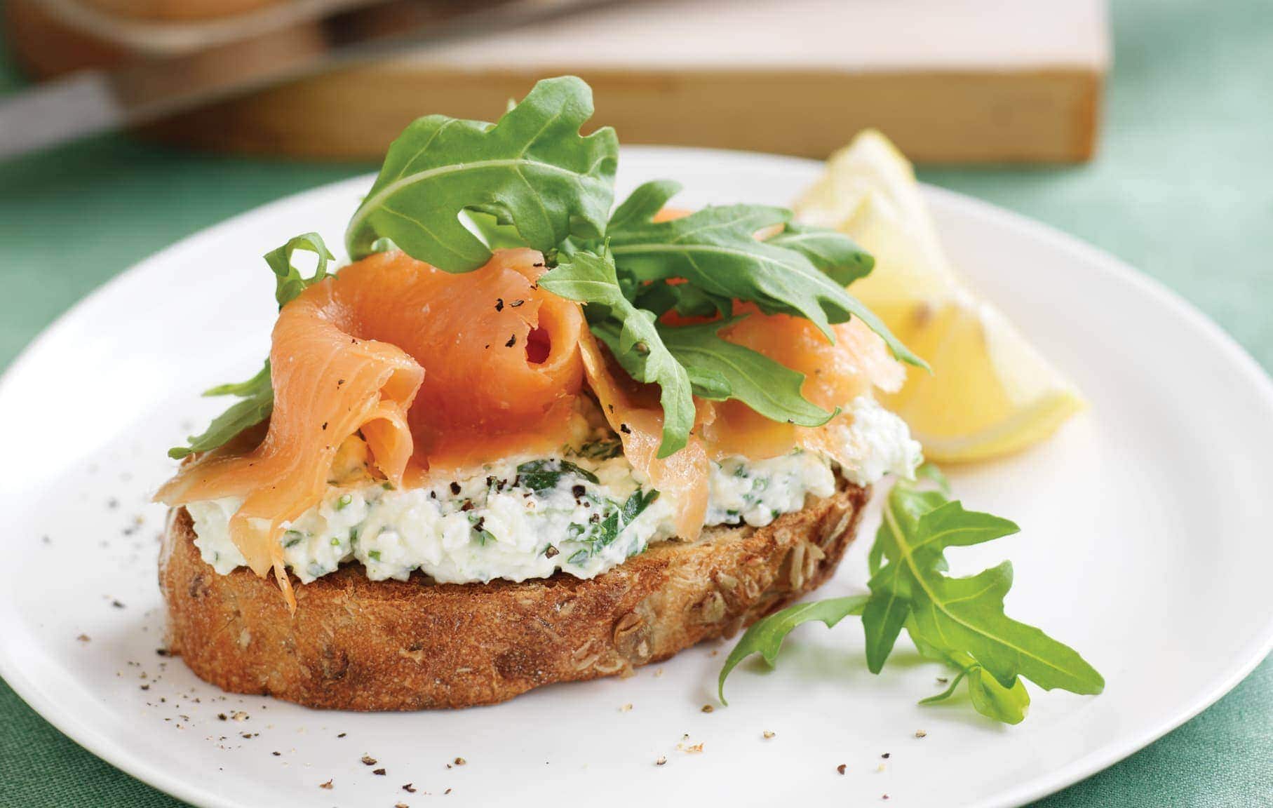 Wholegrain bread with herb cottage cheese, smoked salmon and rocket