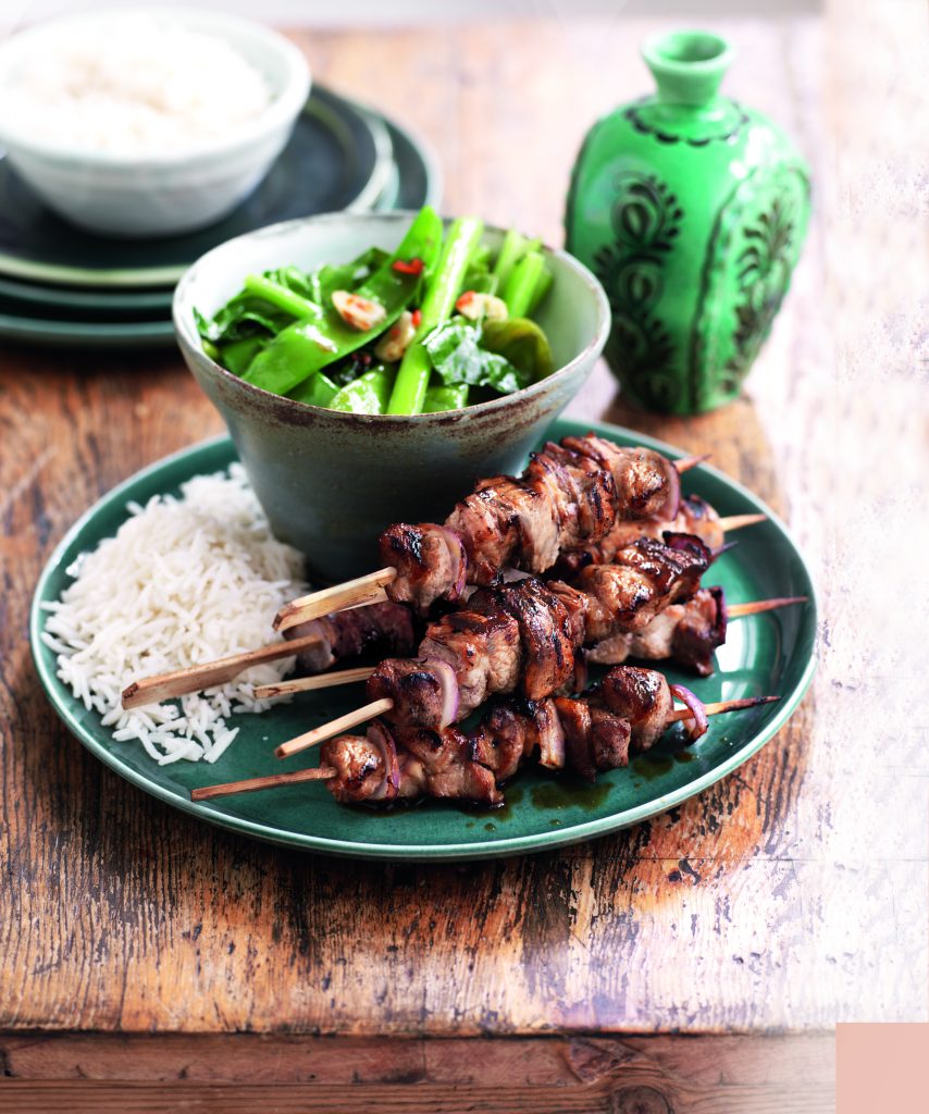 Asian grilled pork skewers with garlic greens Asian grilled pork skewers with garlic greens
