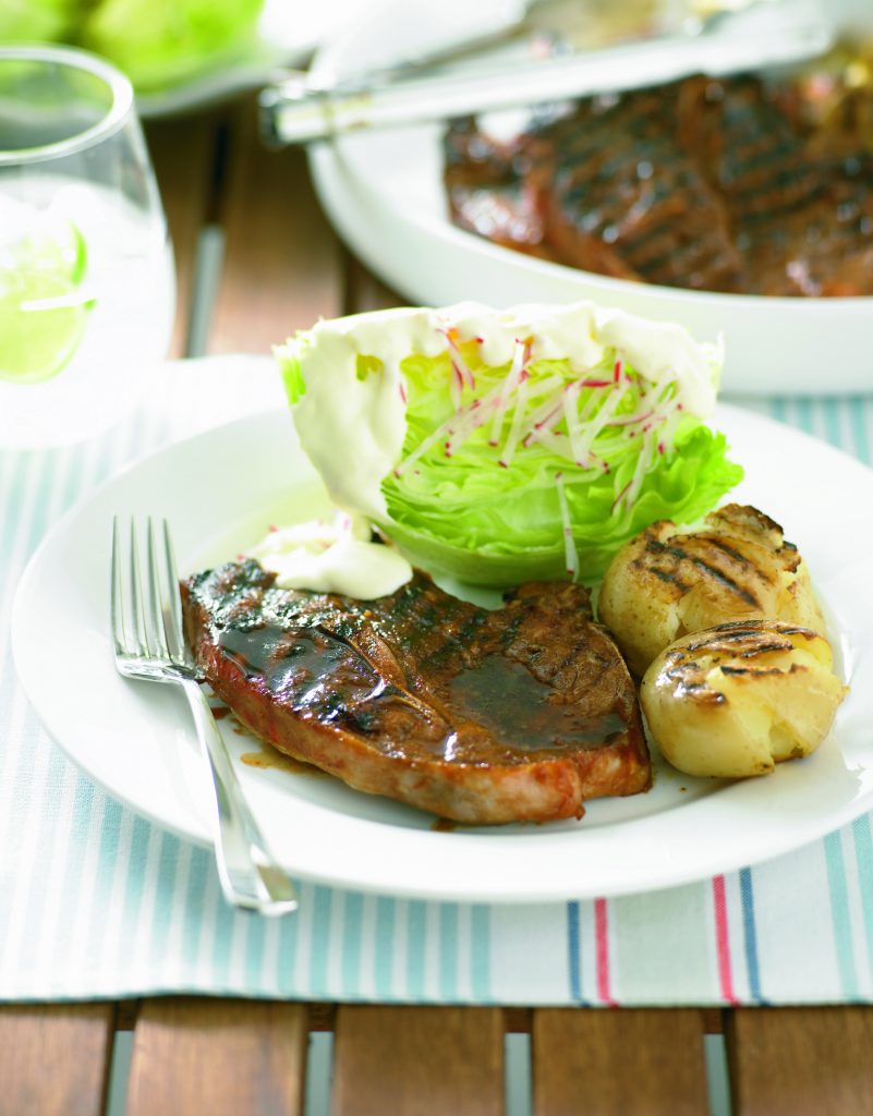 Barbecued lamb chops with potatoes and iceberg lettuce salad Barbecued lamb chops with potatoes and iceberg lettuce salad