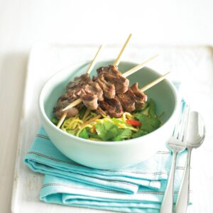 Beef kebabs with vegetable noodle salad