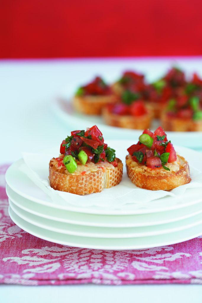 Bruschetta with chickpea spread and basil tomatoes