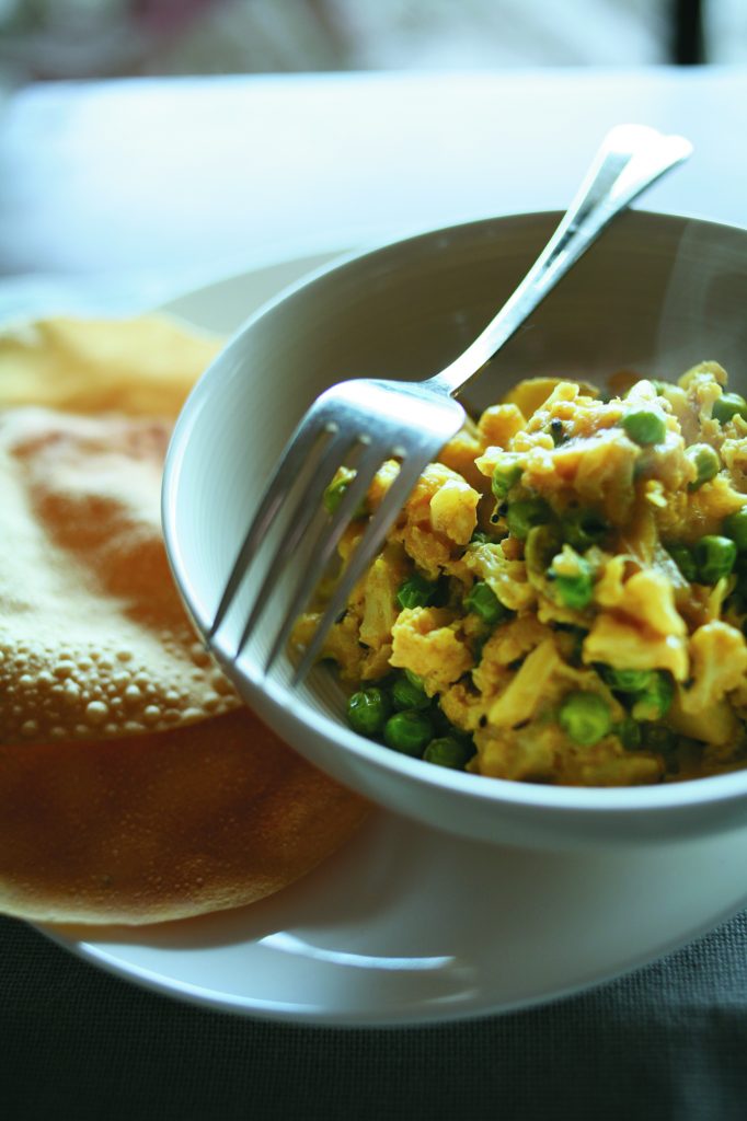Cauliflower, pea and potato curry with poppadums Cauliflower, pea and potato curry with poppadums
