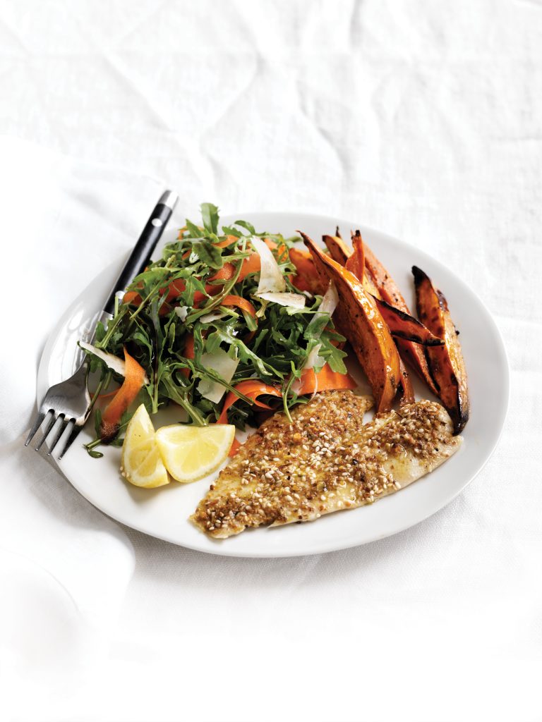 Dukkah-crumbed fish with rocket and parmesan salad and oven-baked chips Dukkah-crumbed fish with rocket and parmesan salad and oven-baked chips