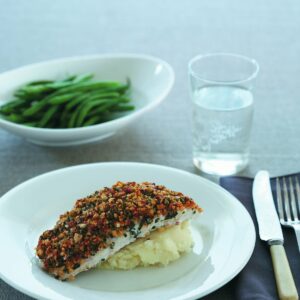 Fish with cashew and basil topping