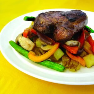 Grilled fillet with spud roasties and sautéed veges