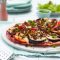 Pizza with spicy lamb and grilled vegetables