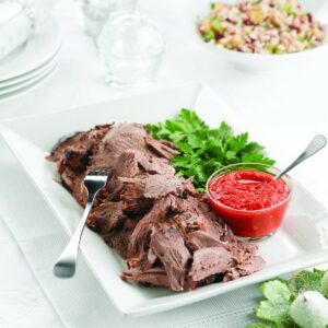 Rosemary-marinated lamb leg with roasted pepper relish