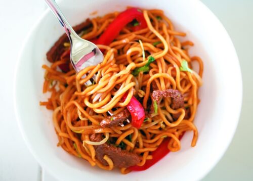 Slivered beef noodles with red capsicum