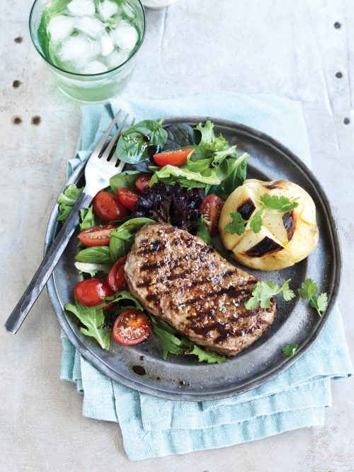 Spice-rubbed steak with baked potatoes