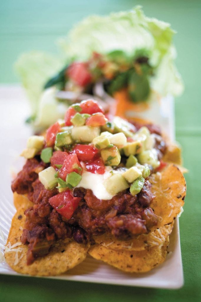 Spicy bean nachos with avocado salsa and salad Spicy bean nachos with avocado salsa and salad