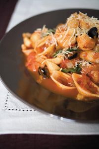 Spinach and black olive sauce with pasta
