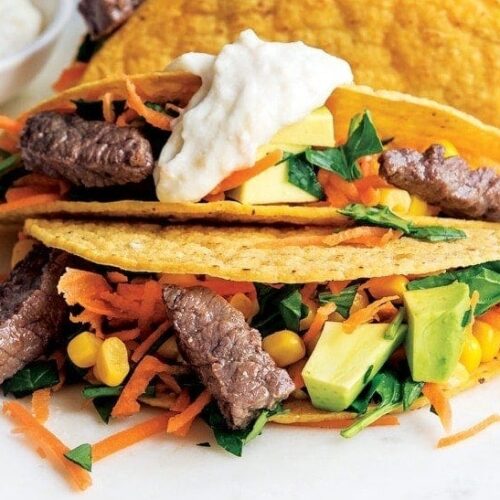 Steak tacos with avocado corn salsa and horseradish drizzle