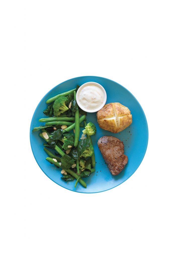 Steak with horseradish cream, baked potato and greens