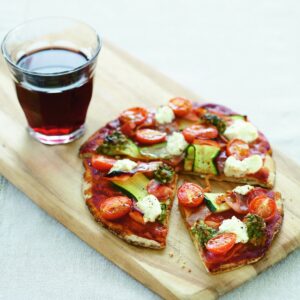 Wholemeal pizzas with ham, courgette and ricotta