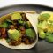Mexican black beans with spicy avocado and grilled tortilla