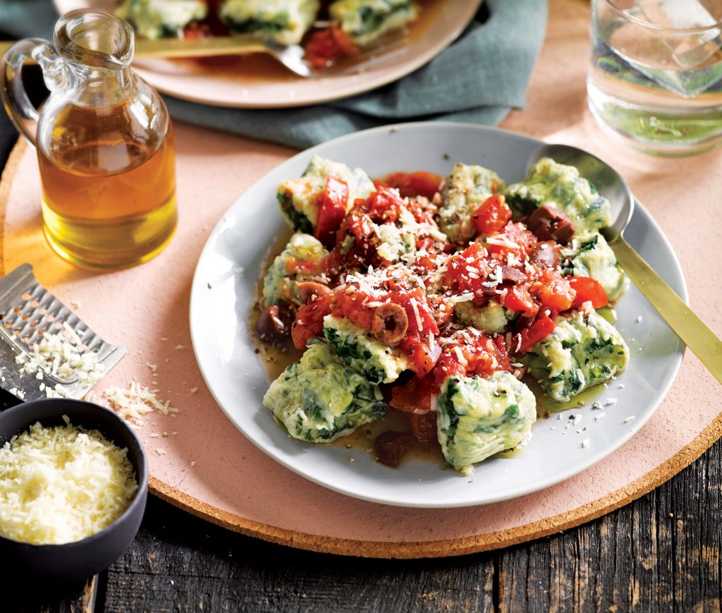 Spinach and ricotta gnudi with tomato and olive sauce