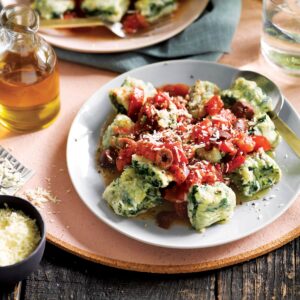 Spinach and ricotta gnudi with tomato and olive sauce