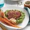 Lamb with broad bean purée and roasted baby carrots