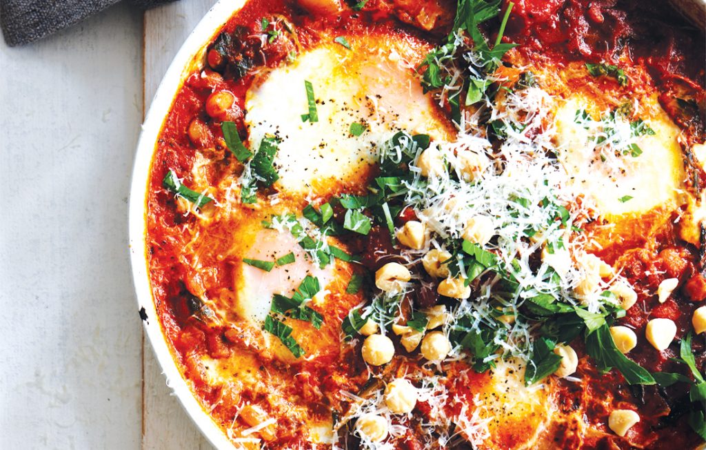 Frying pan baked eggs with harissa and silver beet Frying pan baked eggs with harissa and silver beet