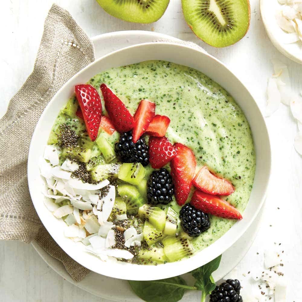 Green ‘hulk’ smoothie bowl Green smoothie decorated with strawberries,blackberries and kiwifruit