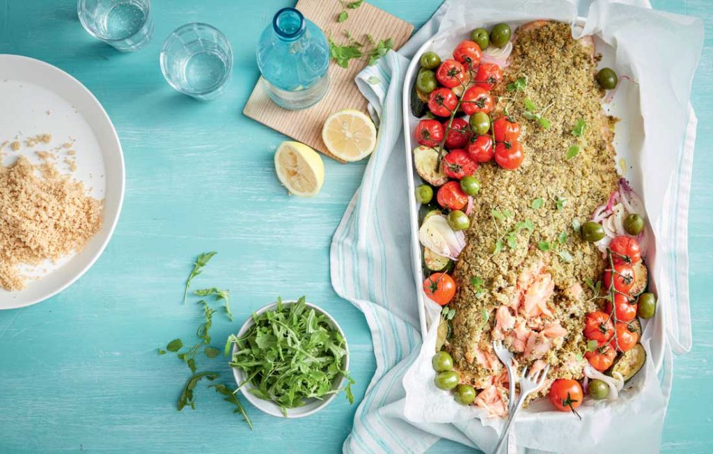 Pesto-crusted salmon with tomatoes and olives Pesto-crusted salmon with tomatoes and olives